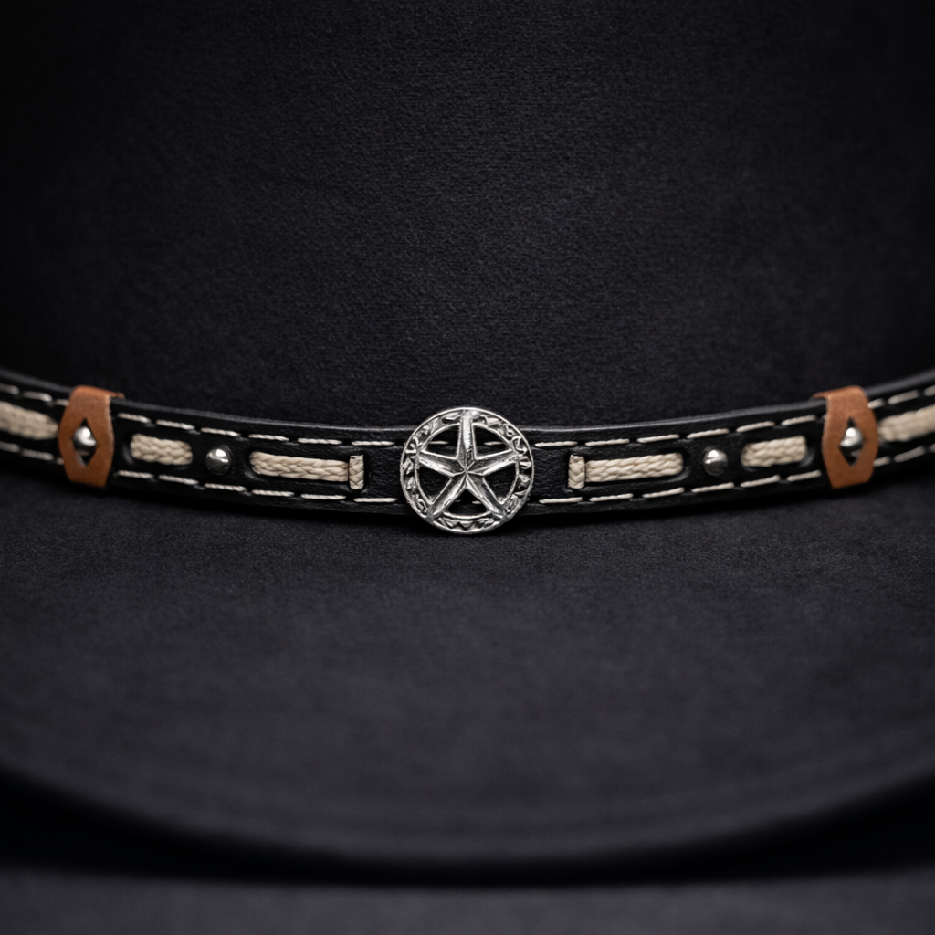 Black leather belt with star buckle on a black background