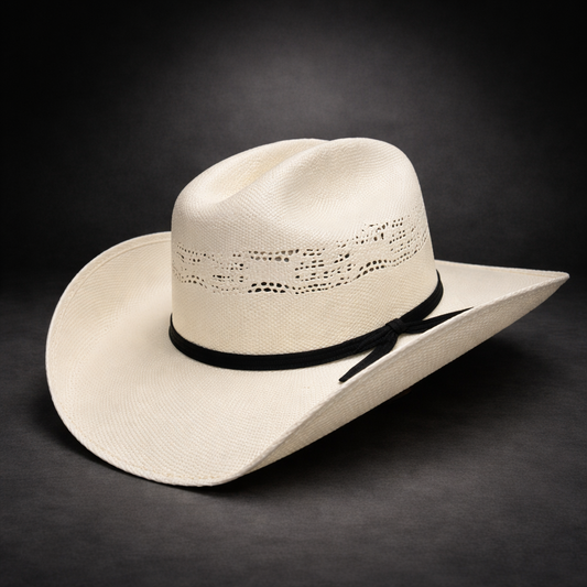 Beige cowboy hat with a black band on a dark background